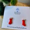 Cute little red clay Christmas stockings with a white silver glitter detail.