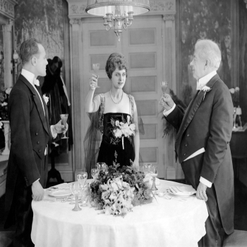 Three people raising glasses