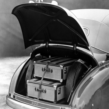 Holy Mackerel off on their travels retro black and white photographic card featuring a vintage image of a classic car with chic suitcases in the boot - 12.6 x 17.7cm and blank inside
